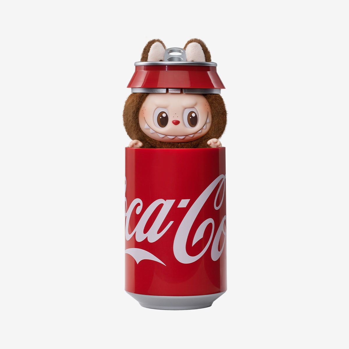 A POP MART Labubu Secret Edition “Mysterious Guest – Coca‑Cola” Plush Keychain, a vinyl and plush hybrid collectible, features Labubu with animal ears peeking from a red Coca‑Cola can design.