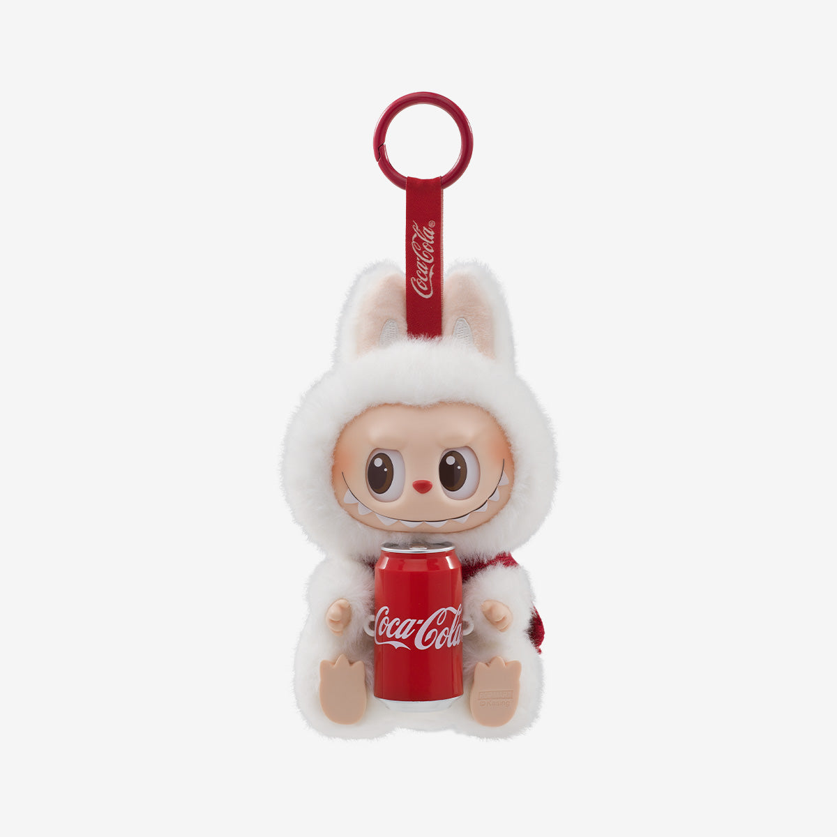 The Labubu Coca‑Cola Happy Factor Plush Keychain – White Bunny Vinyl Collectible by POP MART features a white bunny Labubu holding a red Coke can, with big eyes and a ring for keys. Part of the POP MART The Monsters series.