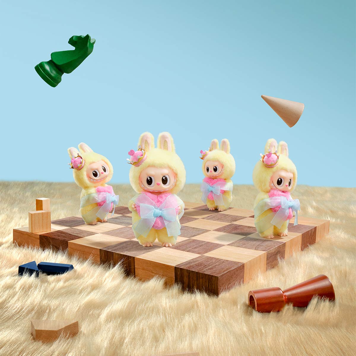 Four Labubu Let's Checkmate Series – Pink Heart Bunny Plush Vinyl Dolls by POP MART stand on a chessboard with falling pieces and wooden shapes on a furry surface, set against a blue background in this whimsical collectible scene.