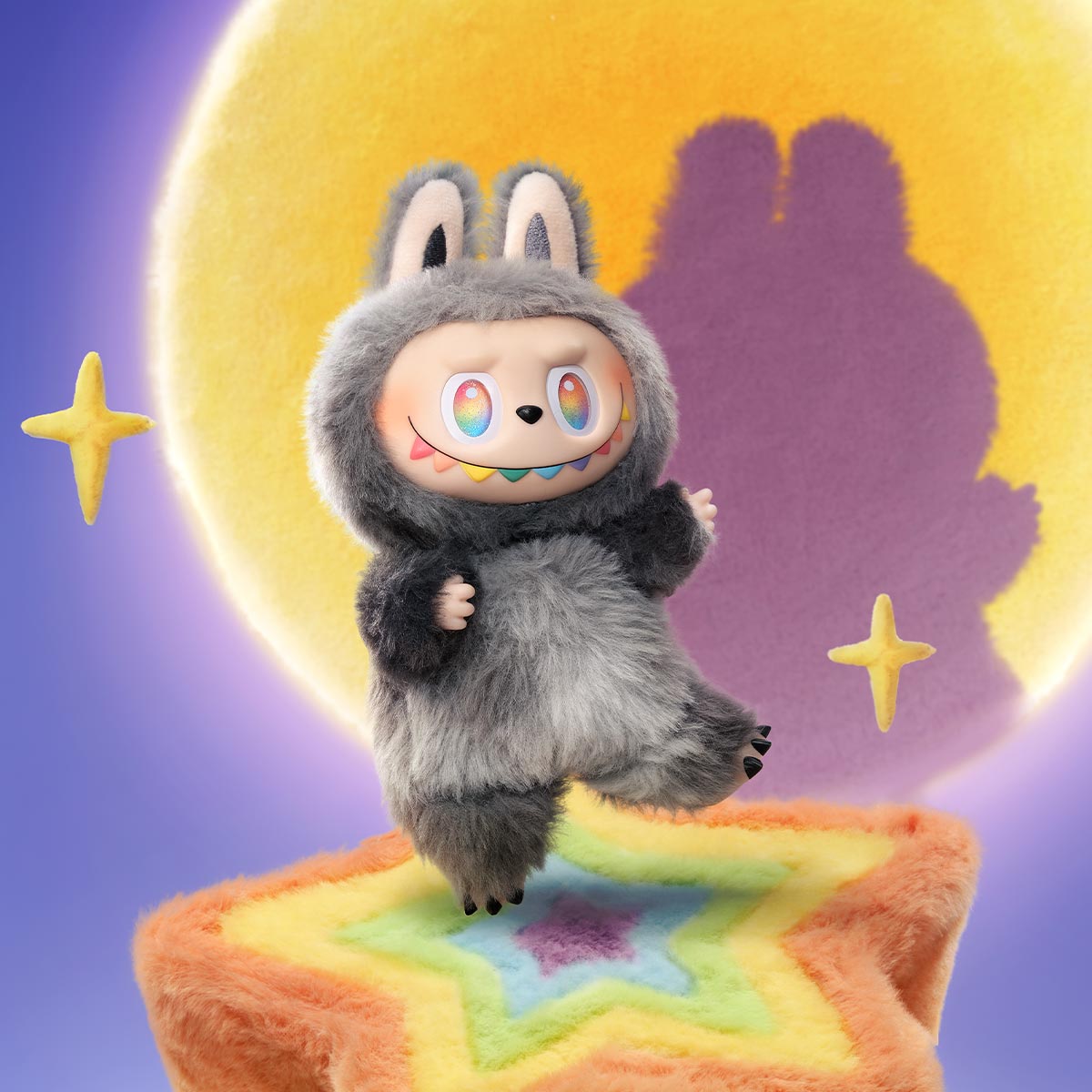 The POP MART Labubu "Secret Edition" Plush Keychain – The Monsters "Big Into Energy" Series Gray Bunny Bag Charm features a grinning bunny with star and moon details, standing on a fuzzy star platform for a whimsical touch.