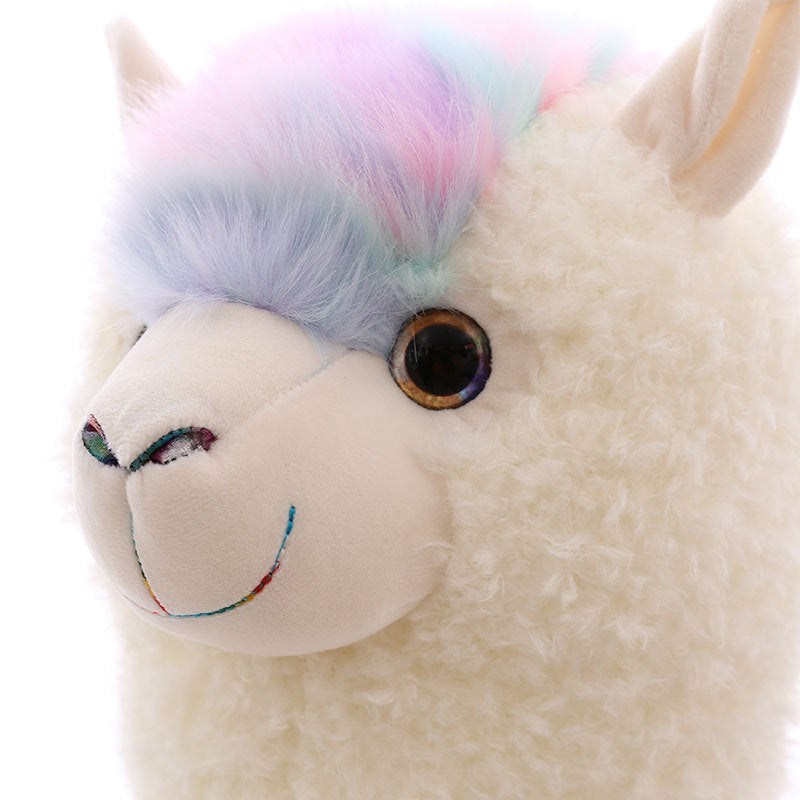 The ZoDoll Cute Alpaca Plush Toy features soft white curly fur, big brown eyes, and a pastel rainbow tuft—perfect for cuddling or decorating your space. Add this adorable stuffed alpaca plush doll to your collection!.
