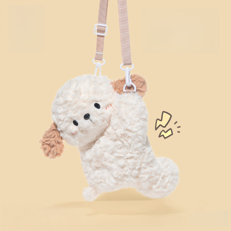 The JOOKI Plush Puppy Crossbody Bag is an 18×26cm fluffy white and brown dog-shaped purse with an adjustable strap, shown against a plain beige background with a small cartoon accent.