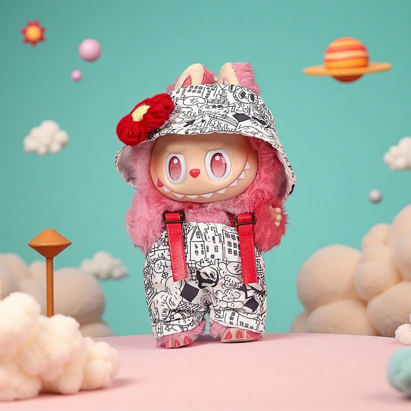 The ZoDoll Labubu Graffiti Print Overalls Set features a plush pink toy with a wide grin, red suspenders, and a hooded cap adorned with a red flower, posed against a whimsical pastel backdrop of clouds and planets.