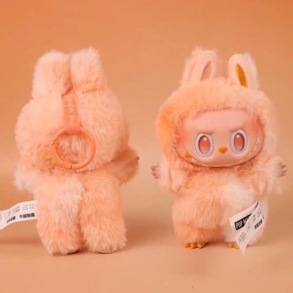 Two Labubu “Happiness” Plush Keychain – The Monsters “Big Into Energy” Series Peach Bunny Bag Charms from POP MART: one front-facing and one back view, perfect as collectibles or cute plush keychains for your bag.