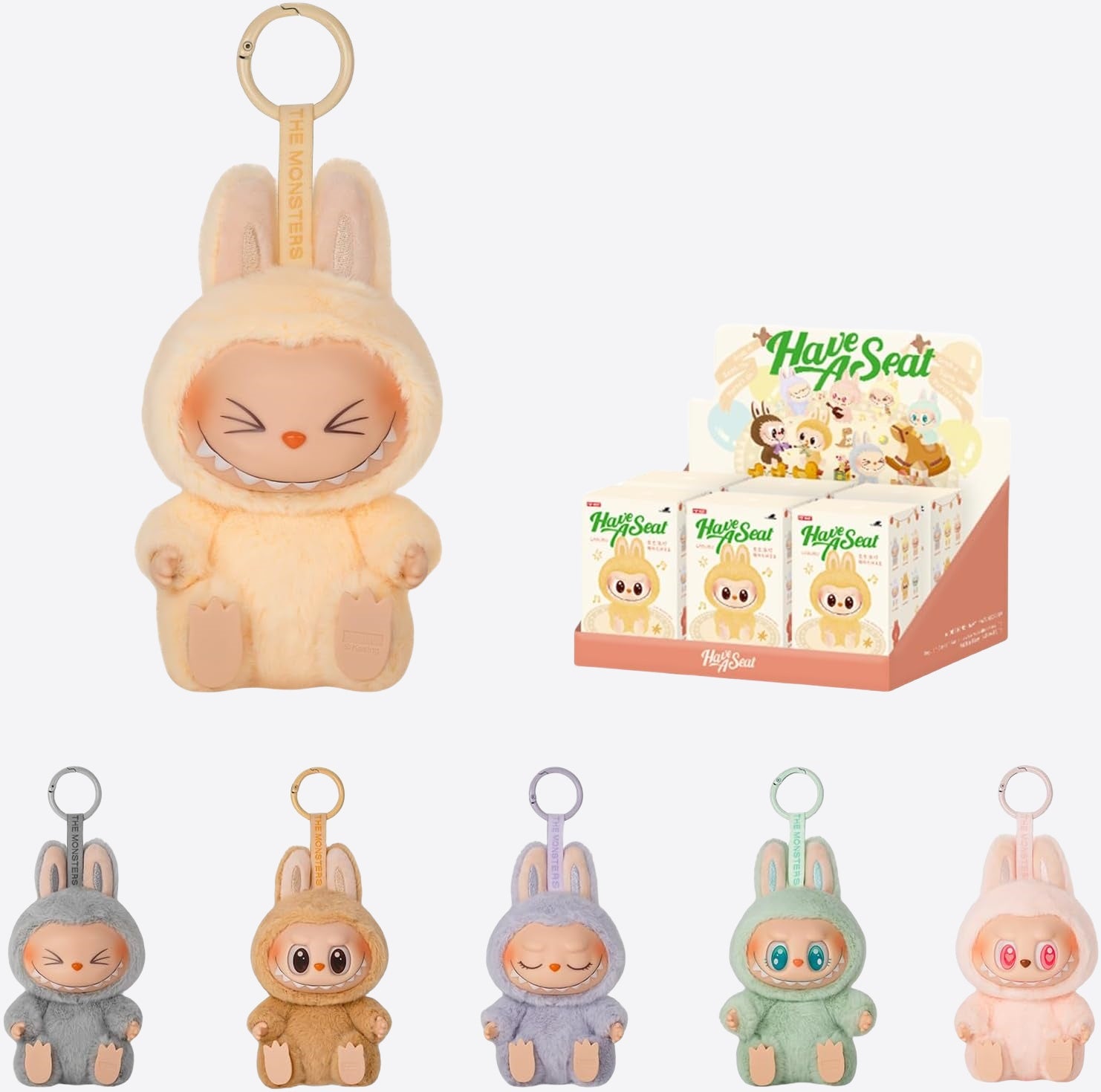 A display of the POP MART Labubu Have a Seat Series Complete 6-Piece Plush Keychain Set, each featuring unique colorful bunnies—no duplicates—with a larger tan bunny and boxed keychains shown in the background.
