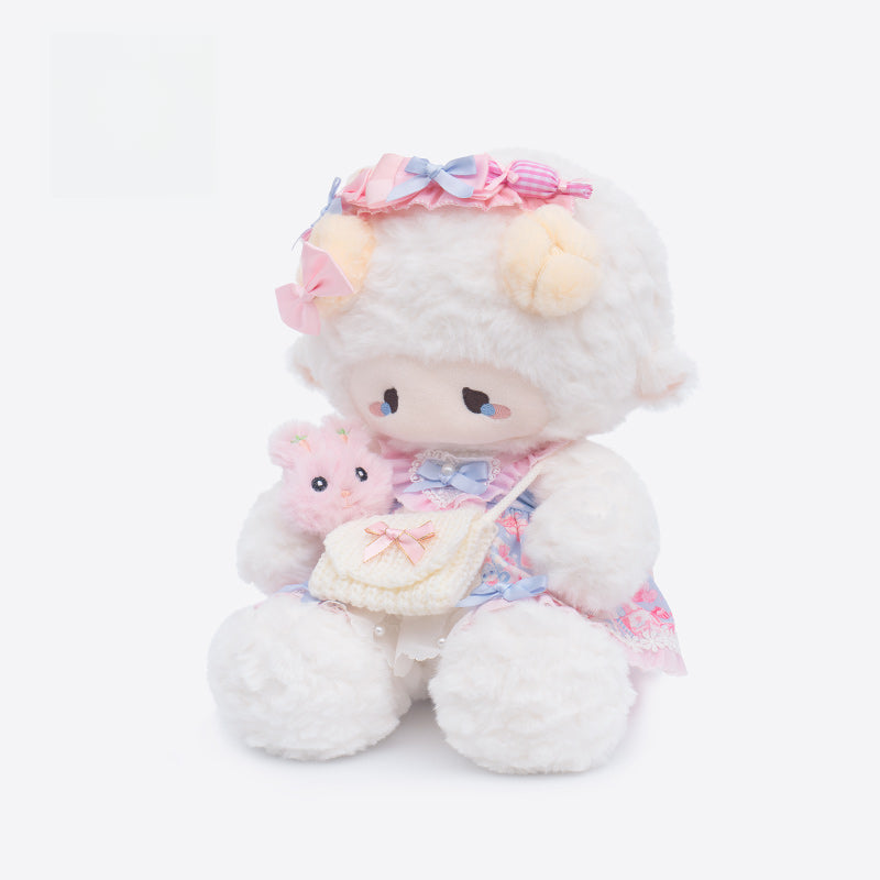 The ZEIO Fashion Sheep Plush Toy 29cm is a cute dressed lamb doll in a pastel floral dress with bows, holding a pink plush and cream purse, posed upright against a plain white background.