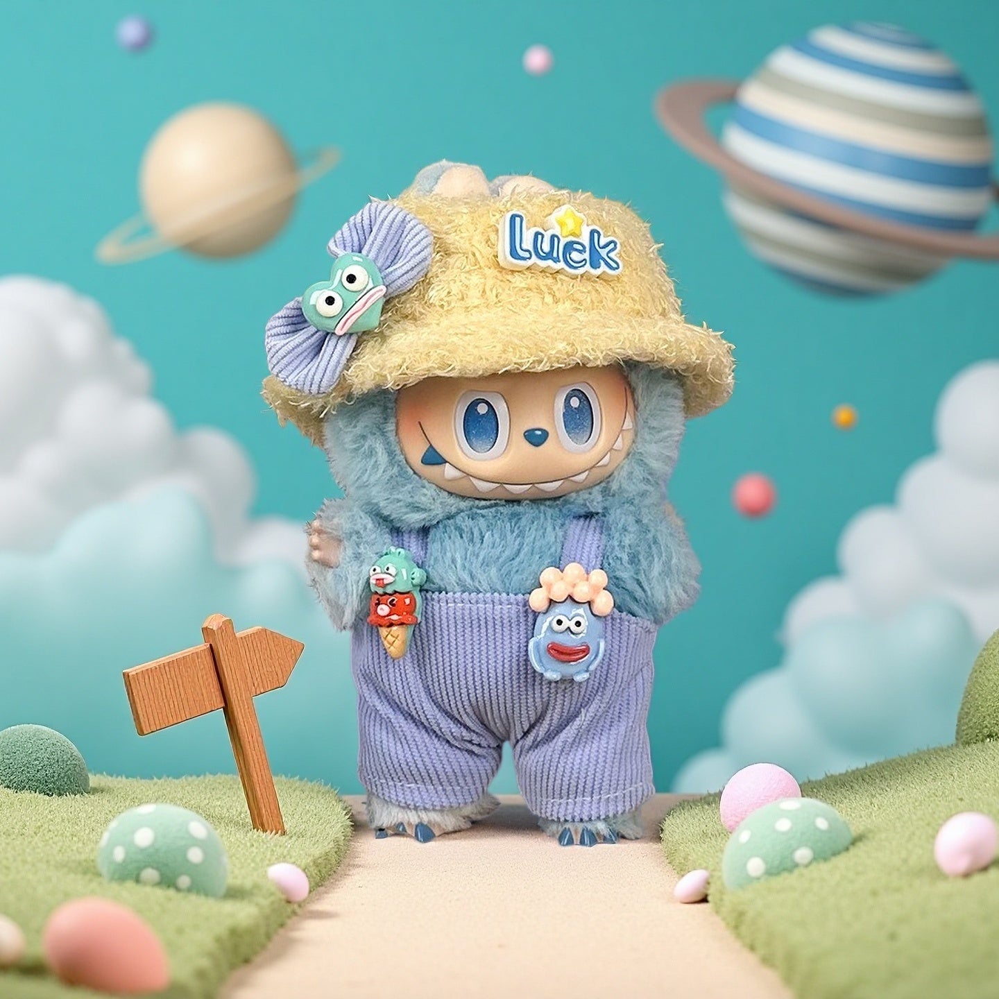 The ZoDoll Labubu Doll wears the Lucky Bucket Hat and Corduroy Overalls Outfit Set, standing on a whimsical path with planets, clouds, and mushrooms in the background.