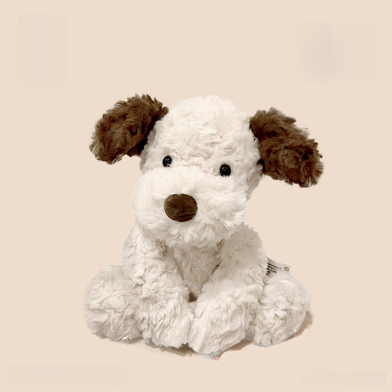 The JOOKI 35cm Plush Puppy Stuffed Toy features soft brown and white fur with floppy ears, sitting upright against a plain beige background.