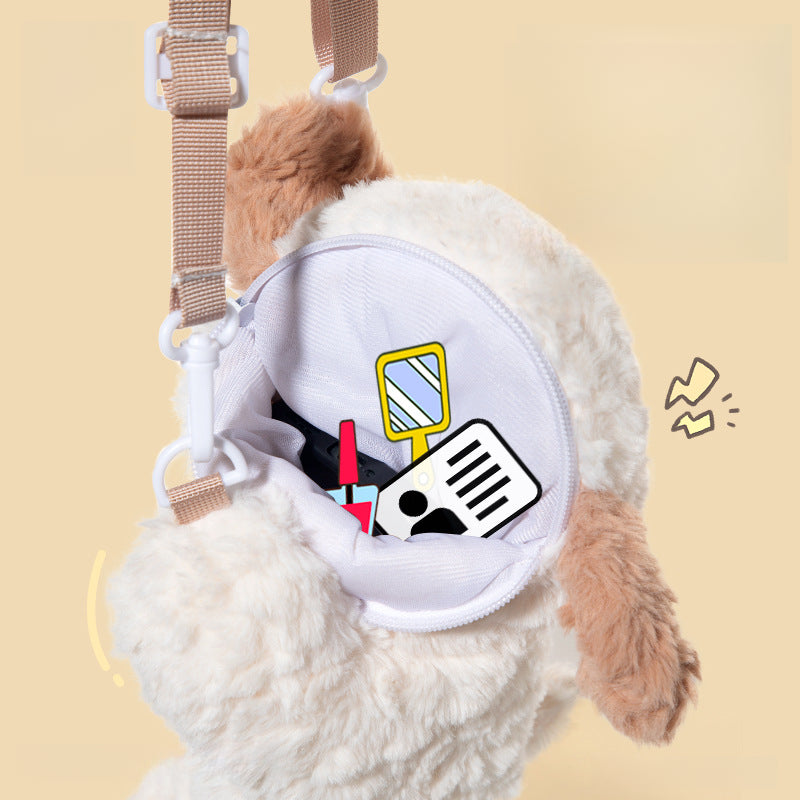 The JOOKI Plush Puppy Crossbody Bag (18×26cm) is a kawaii, fluffy dog stuffed purse with a zipper opening that reveals cartoon illustrations of a mirror, notepad, and more inside, against a beige background.