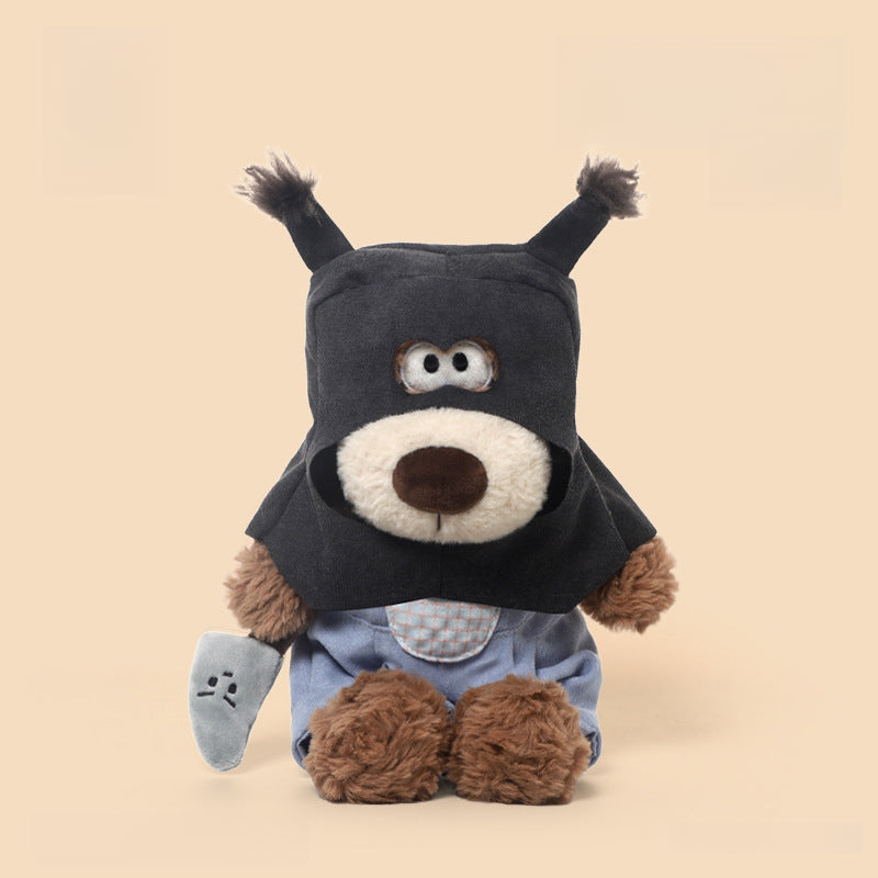 The JOOKI 40cm Funny Robber Dog Plush Toy is a dressed-up stuffed puppy with a mask and outfit, sitting against a beige background. This novelty plush makes an adorable addition to any collection!.