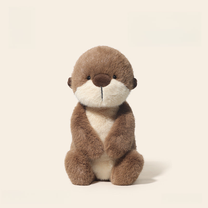 The JOOKI 36cm Otter Plush Toy, featuring soft brown and cream fur, sits upright against a plain light background—ideal for woodland nursery decor.