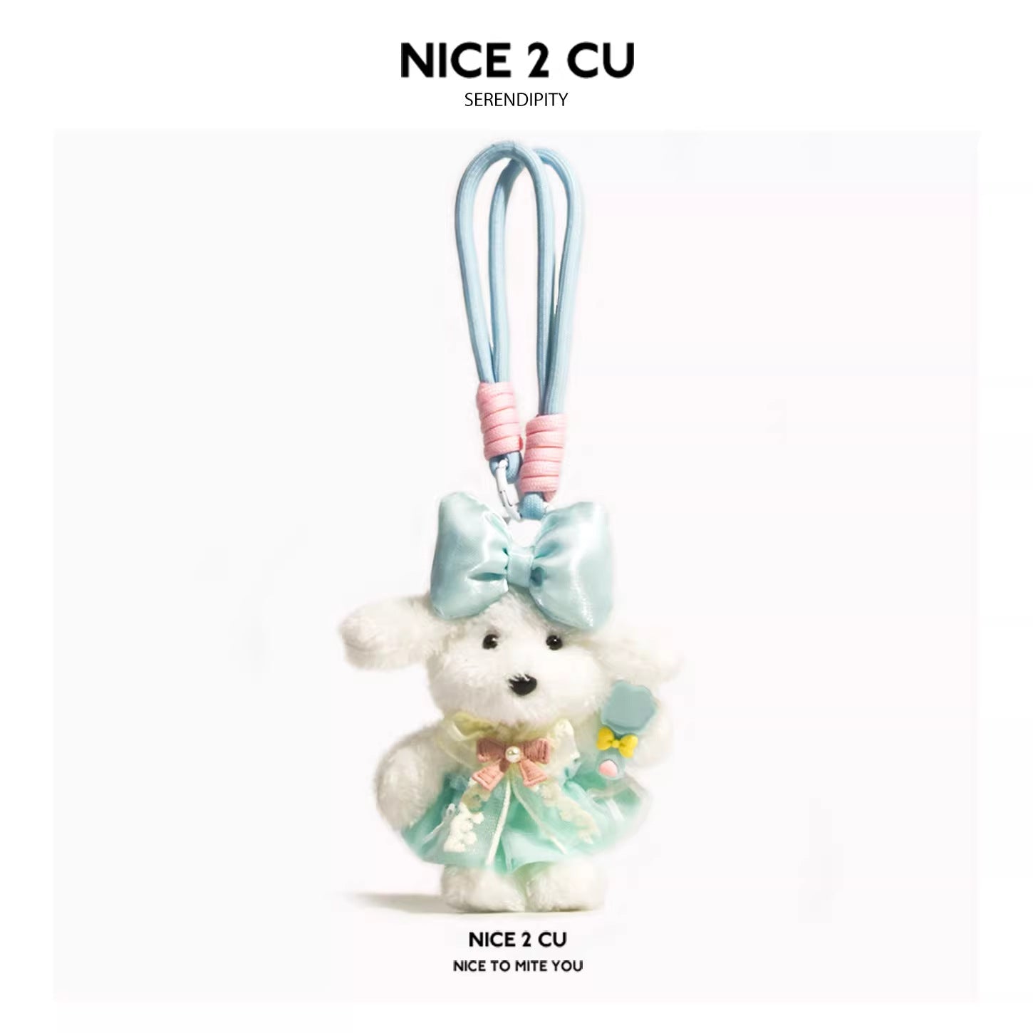 White plush dog charm in a mint-green princess dress with a large light-blue head bow and pastel loop strap