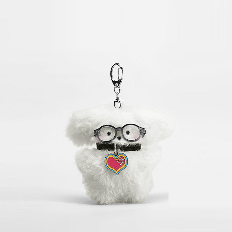Fluffy white dog plush keychain charm with round black glasses and multicolor swirl heart pendant