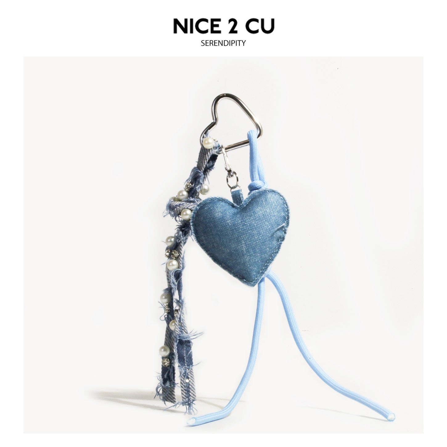 Light wash denim stuffed heart charm keychain with blue ribbon strap and heart-shaped carabiner