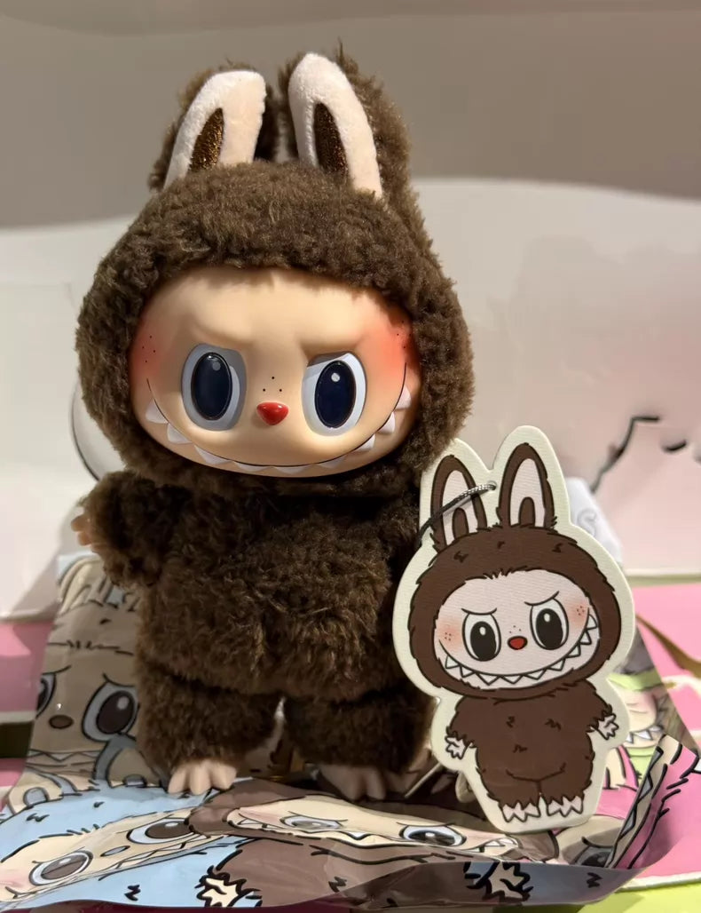 The Labubu Secret Edition “Chestnut Cocoa” Plush Keychain by Kasing Lung from POP MART features a standing brown bunny with wide eyes and a mischievous grin—perfect for vinyl collectible and plush keychain fans.