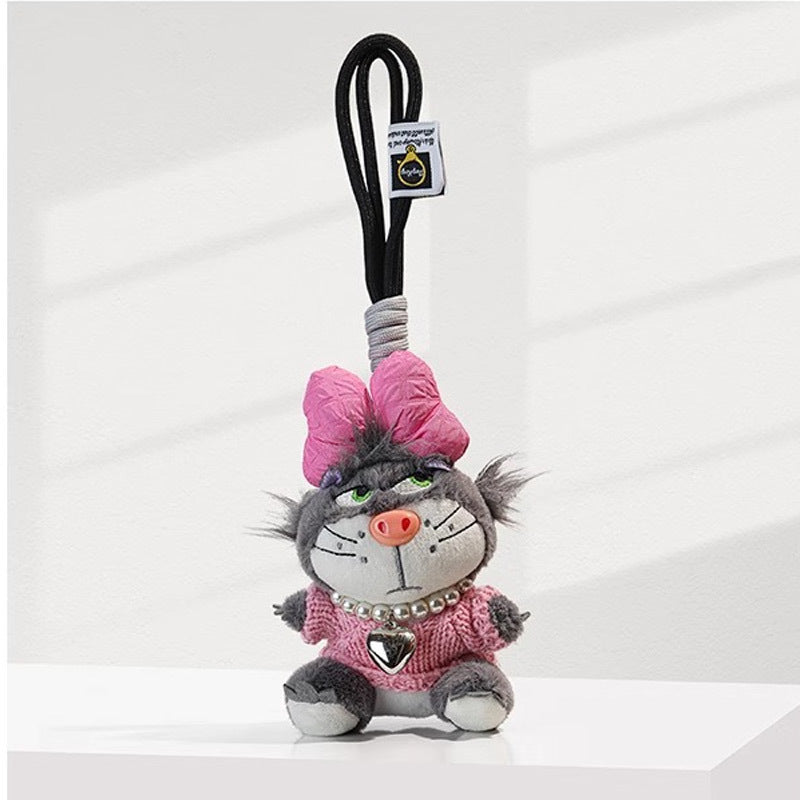 Grey cat plush charm wearing pink knit top, oversized pink bow, and heart pendant necklace
