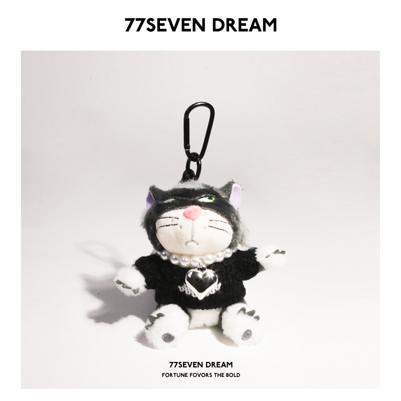 Black-face cat plush charm in black sweater with white heart pattern and bead necklace