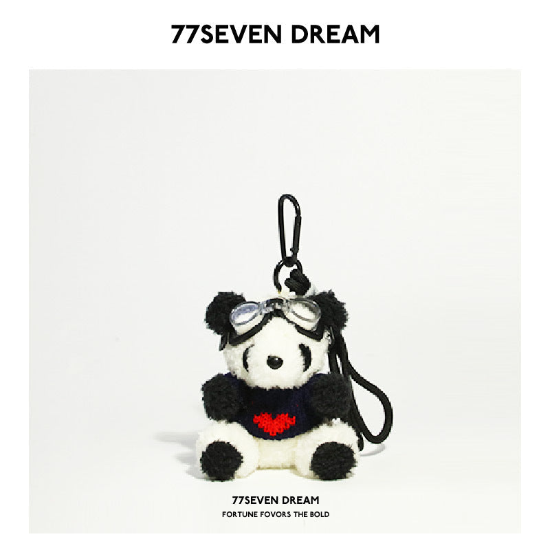 Panda plush keychain charm in black sweater with red heart design and clear aviator goggles