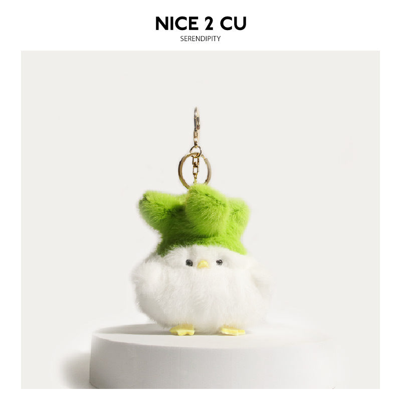 White fluffy plush chick keychain charm with bright green fluffy hat and gold-tone clip attachment