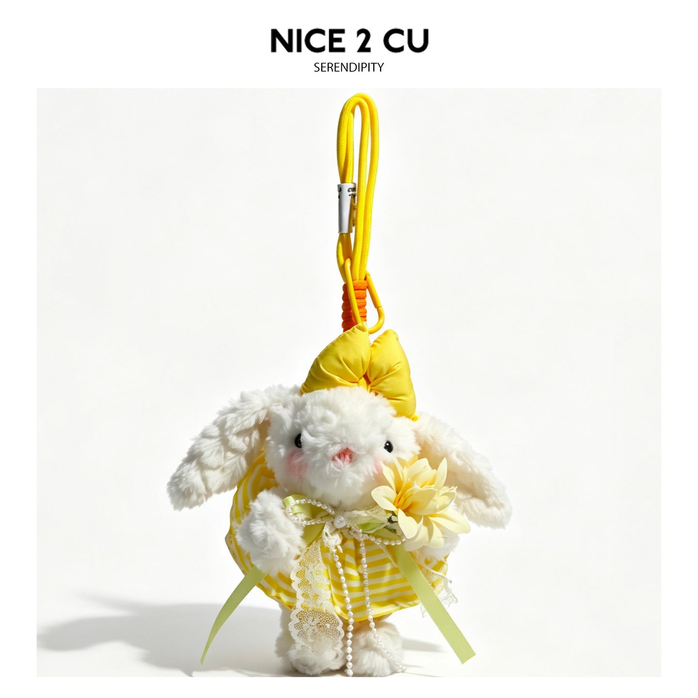 White lop-eared rabbit plush keychain pendant dressed in a bright yellow floral dress with yellow bow and green ribbon accent