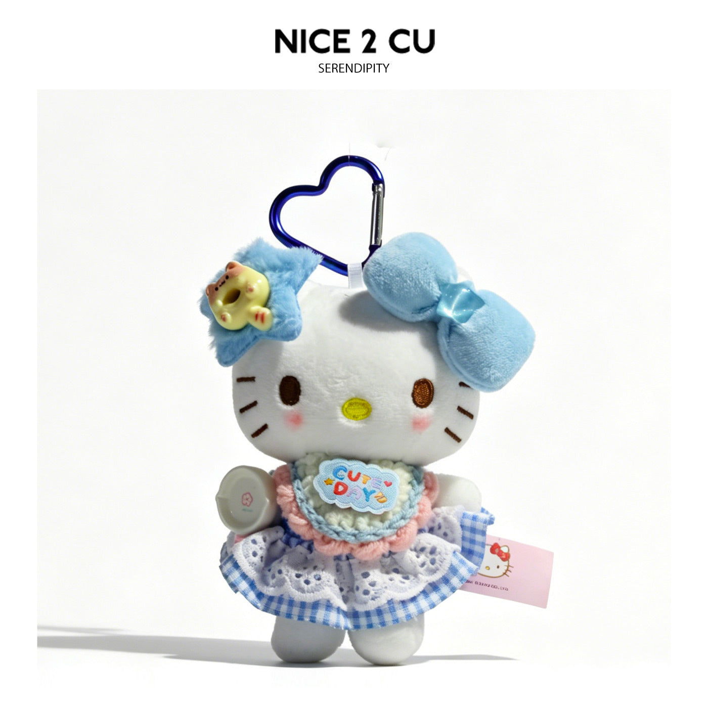 Kawaii cat plush charm with blue star hair accessory and pastel gingham dress