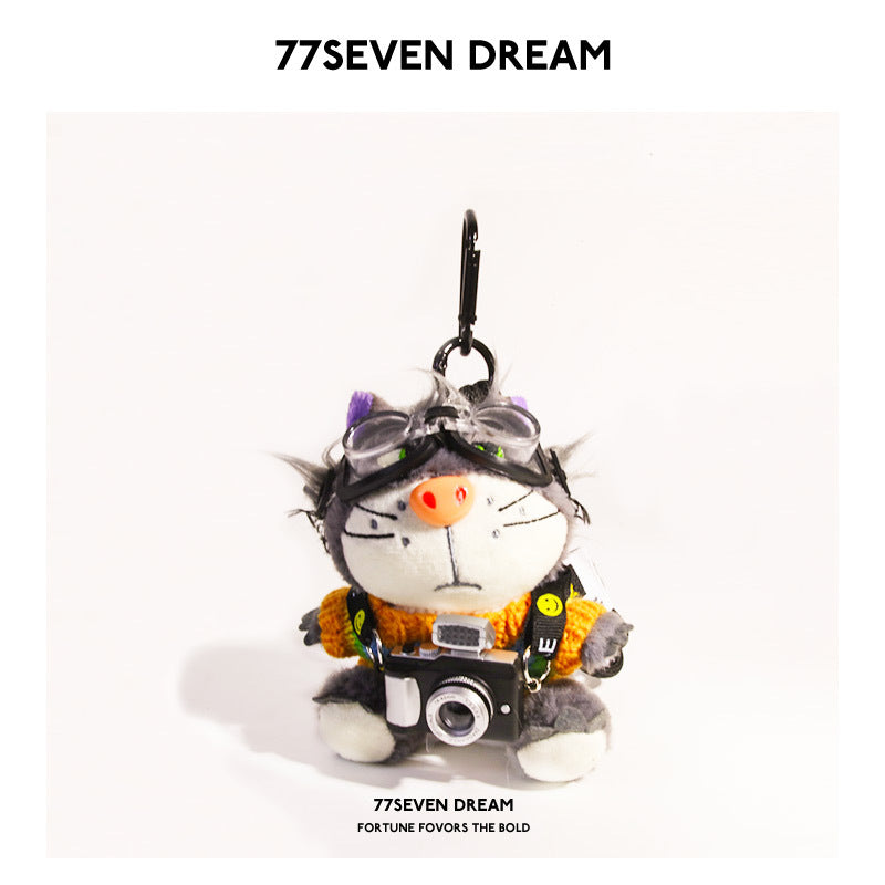 Cool cat plush keychain in multicolor warm-toned knitted outfit with mini camera and clip