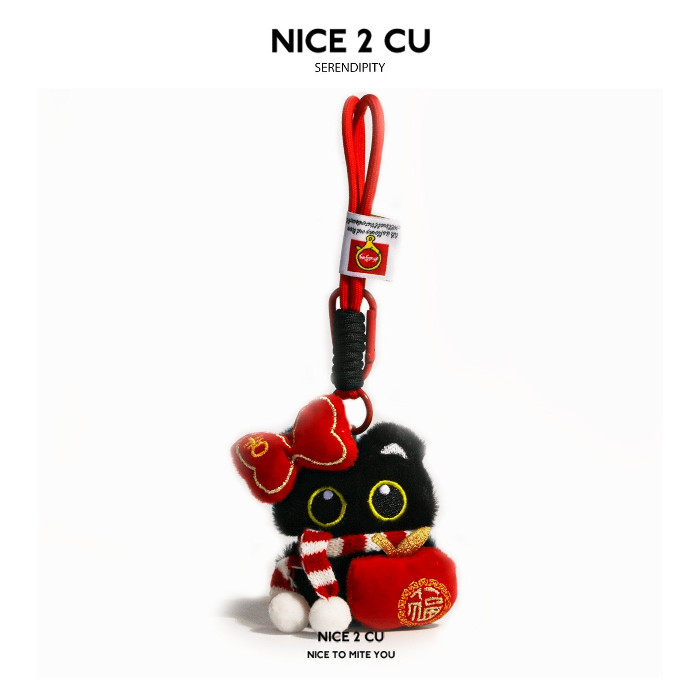 Black cat plush charm with red apple-shaped ornament, striped scarf, and gold-embroidered bow