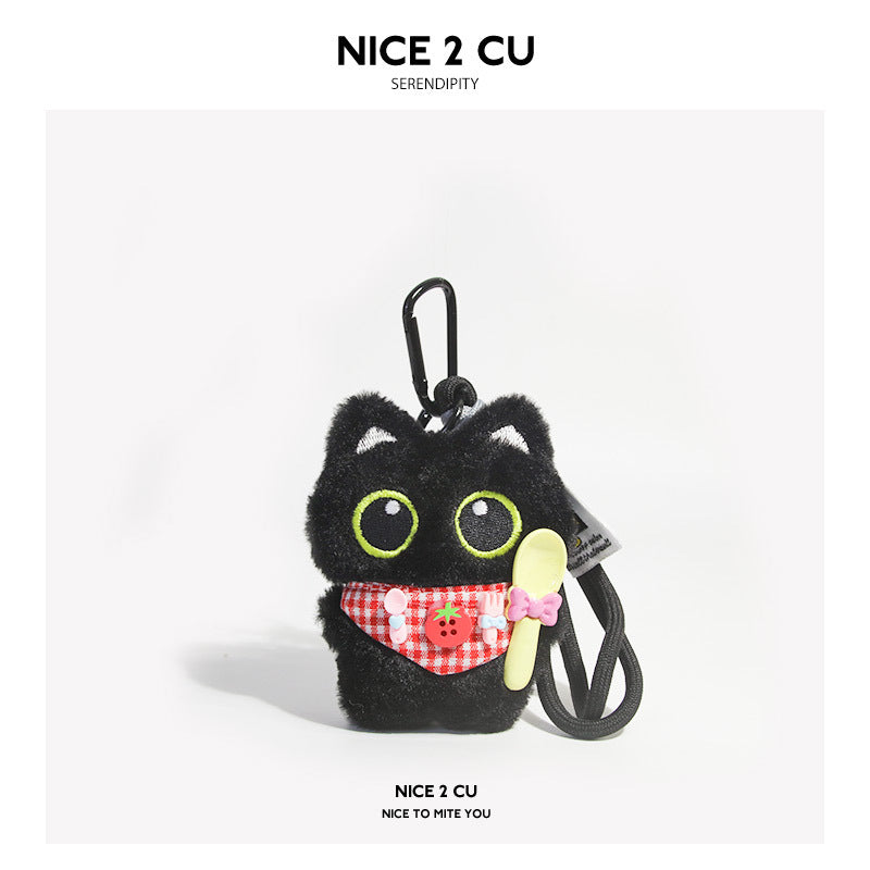 Black cat plush charm wearing a red checkered bib and holding a yellow spoon