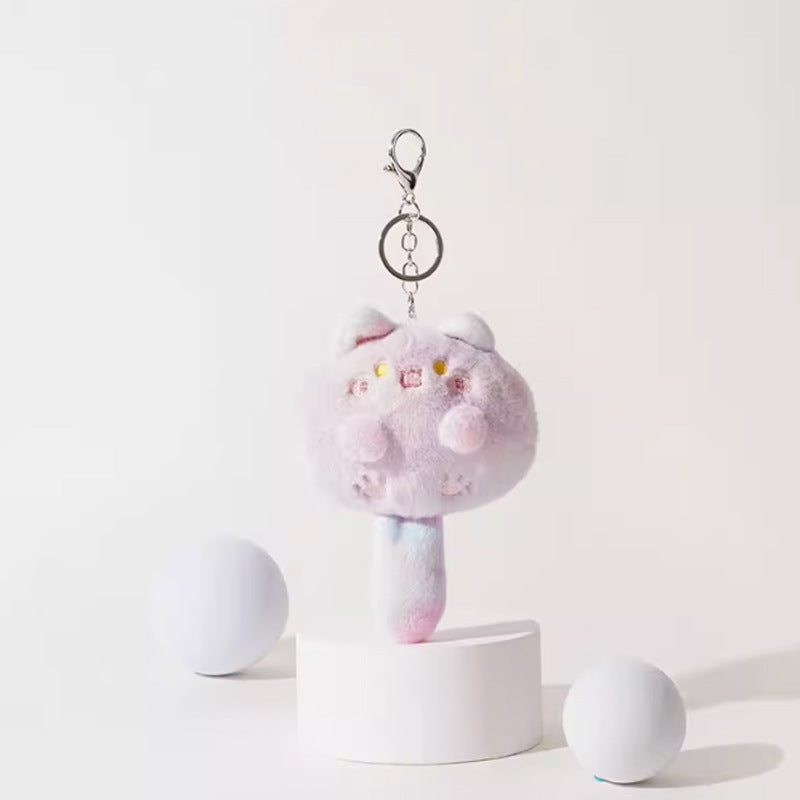 Pastel pink and lavender kawaii plush cat keychain with multicolor stem and silver metal clip