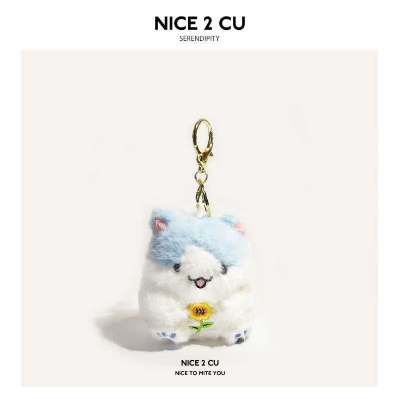 Blue-hat kawaii plush hamster bag charm with sunflower embroidery and gold-tone clip hardware