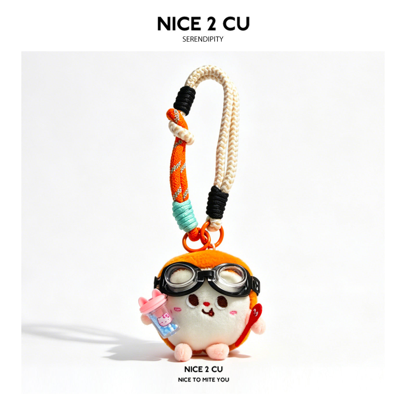 Pilot bread-bun plush charm with black aviator goggles, orange cap, and colorful braided rope loop bag charm