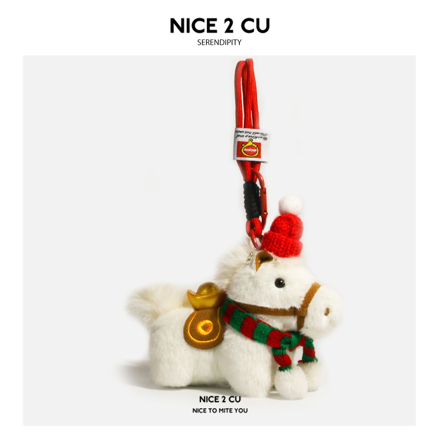 White plush horse ornament with red-and-green striped scarf, red hat, and carabiner hook attachment