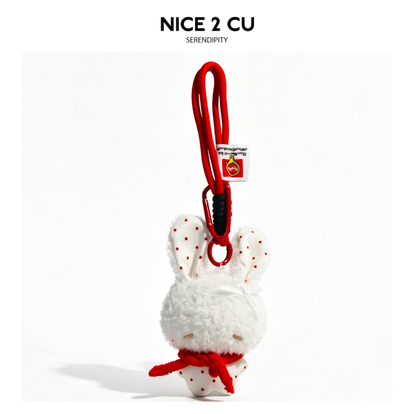 White plush bunny charm with red polka-dot ear lining and red accent clip