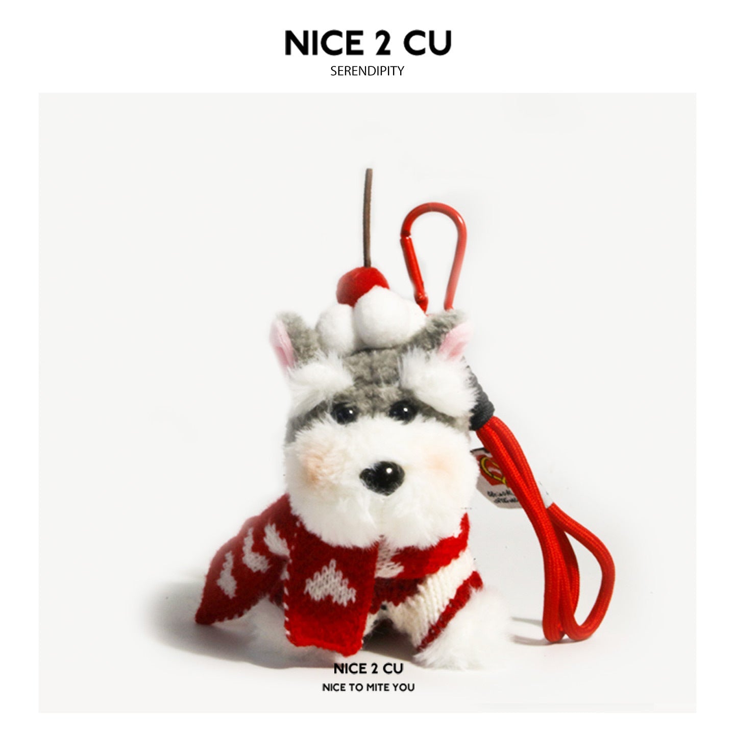 Grey Schnauzer plush charm wearing a red-and-white knitted Christmas sweater, scarf, and reindeer-antler pompom hat with red 