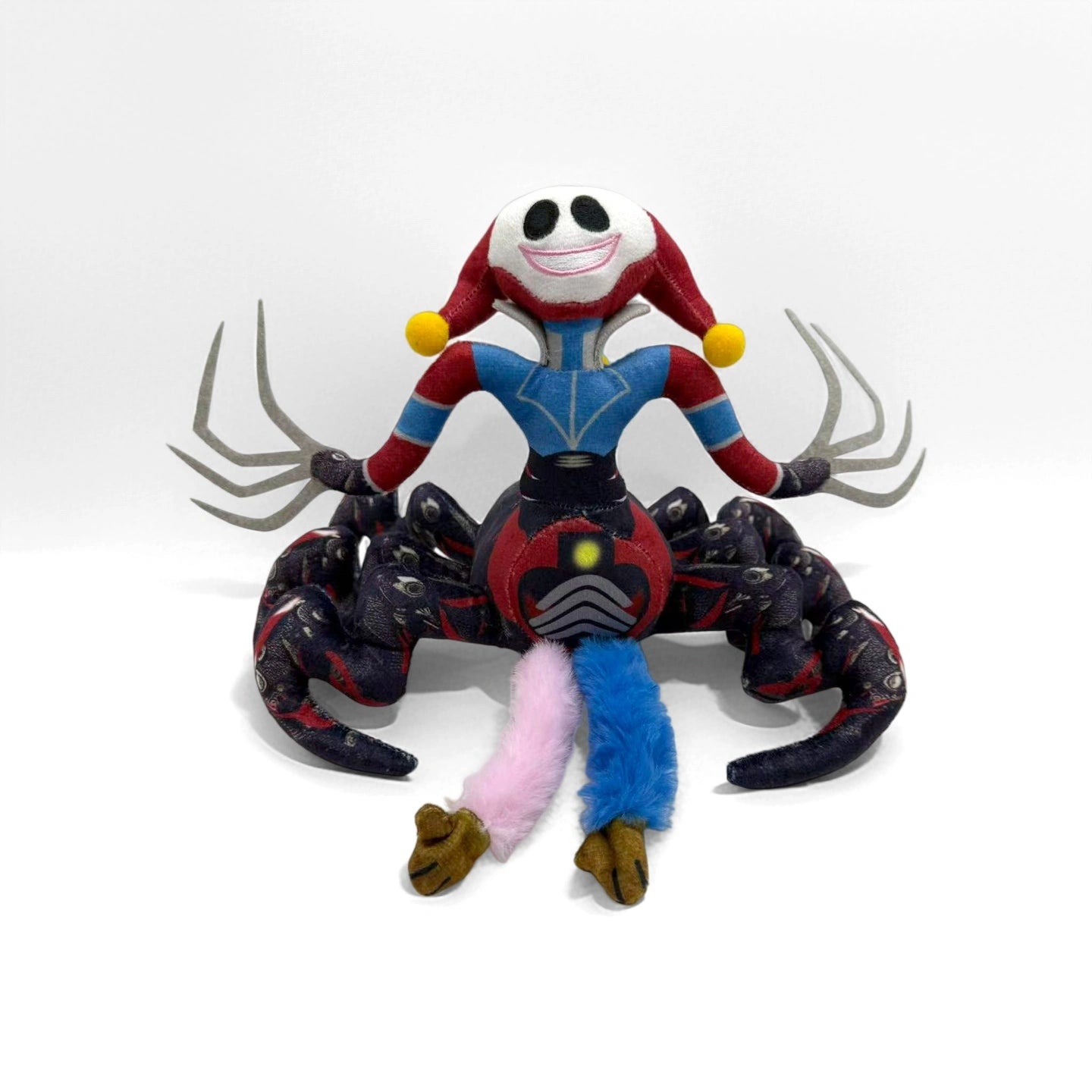 The ZoDoll Prototype Plush is a 32cm Poppy Playtime Horror Spider Monster with a clown face, jester hat, spider-like body, and colorful blade-shaped limbs—a unique collectible soft toy inspired by the game.