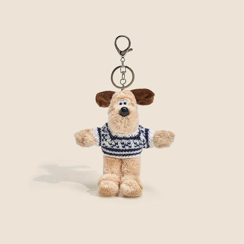 Long-fur cream dog plush charm wearing dark navy and white striped knitted sweater