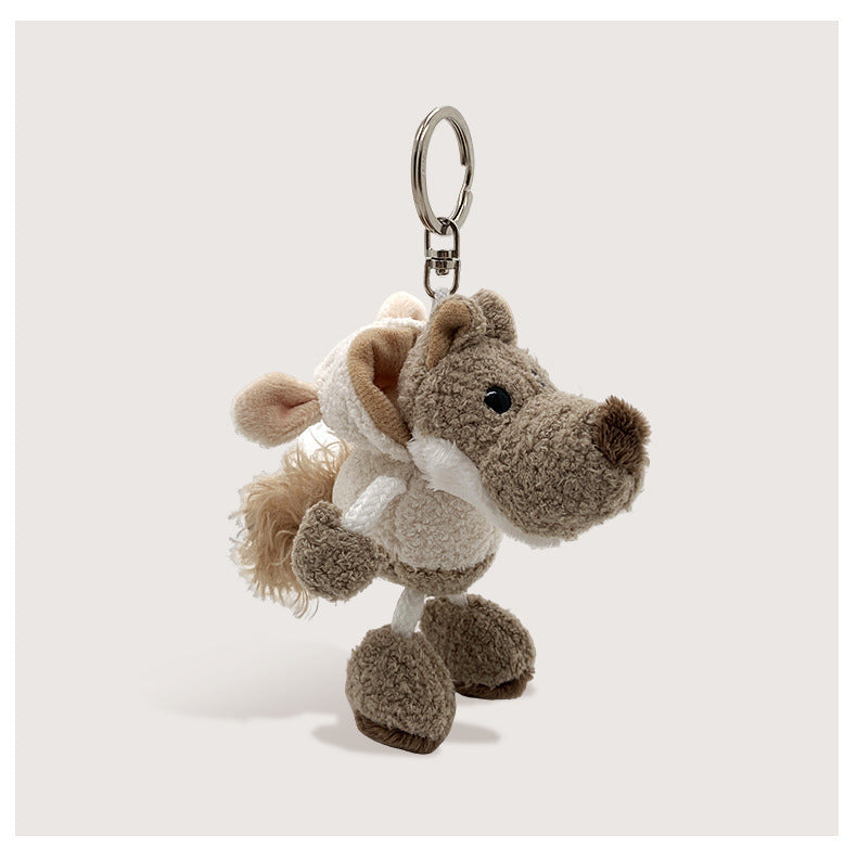 White wolf plush keychain charm wearing a cream hooded sheep costume with fluffy beige fringe trim and silver split ring