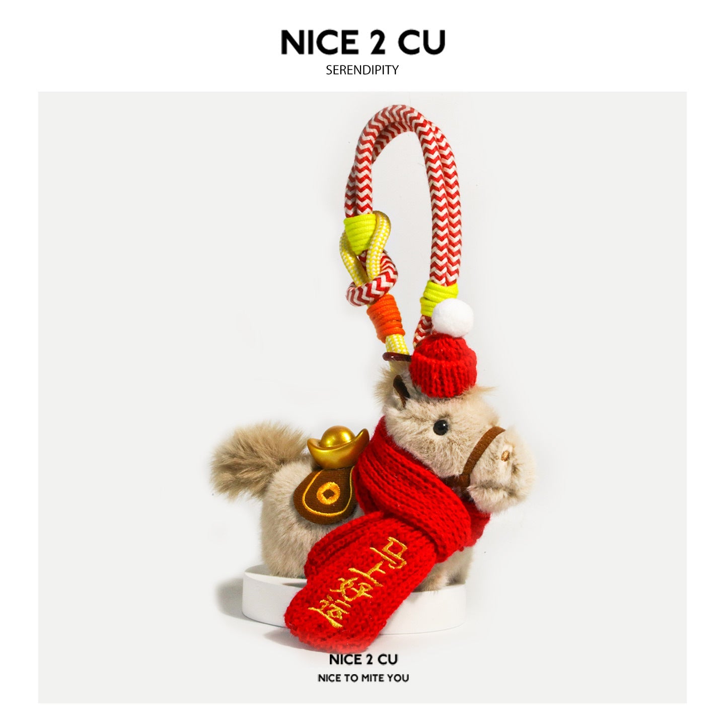 Light brown plush horse ornament with red scarf, gold ingot accent, and braided red-white wrist-loop cord