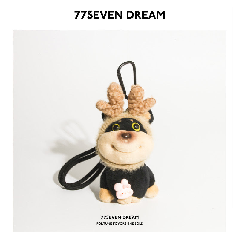 77SEVEN DREAM Bee Dog plush charm with brown antler ears, black-and-tan body, and flower chest detail on white background