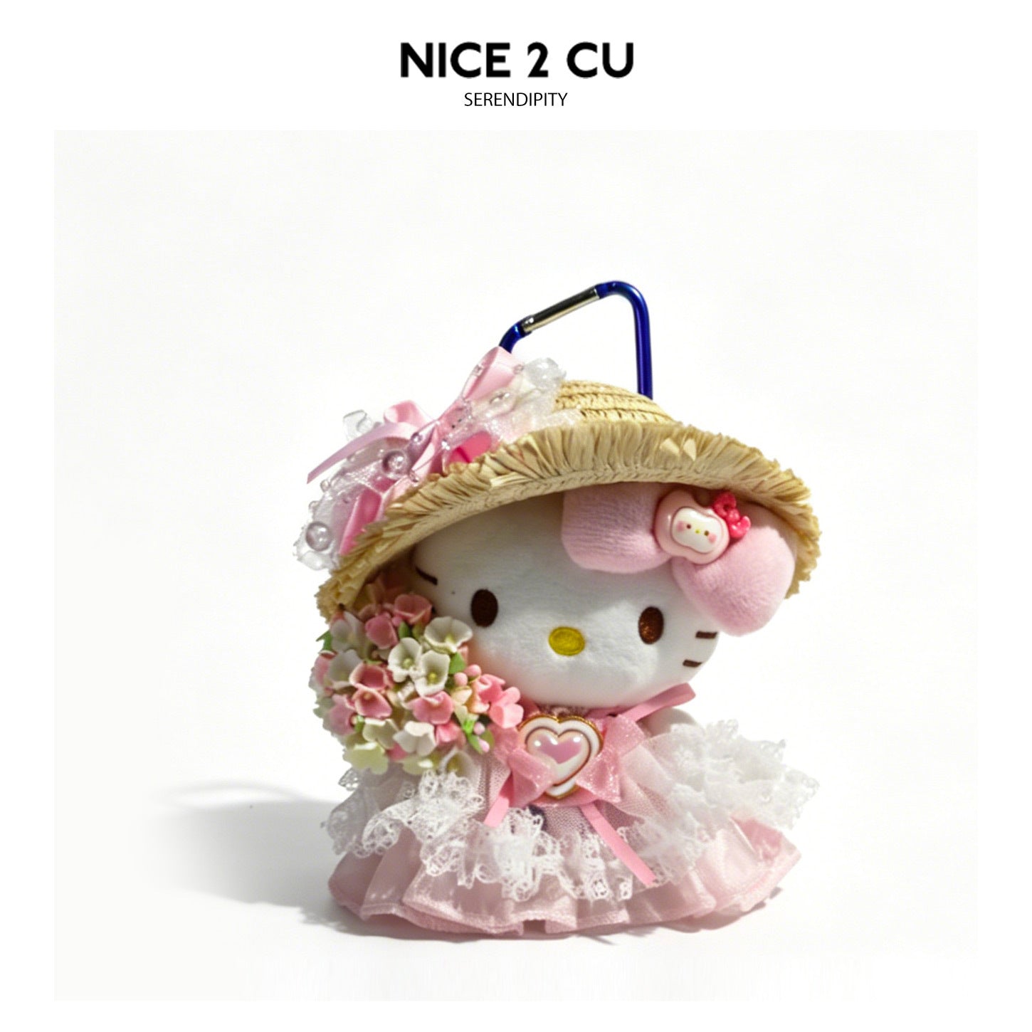 White cat plush charm wearing pink straw hat, floral dress, and pink bow accents