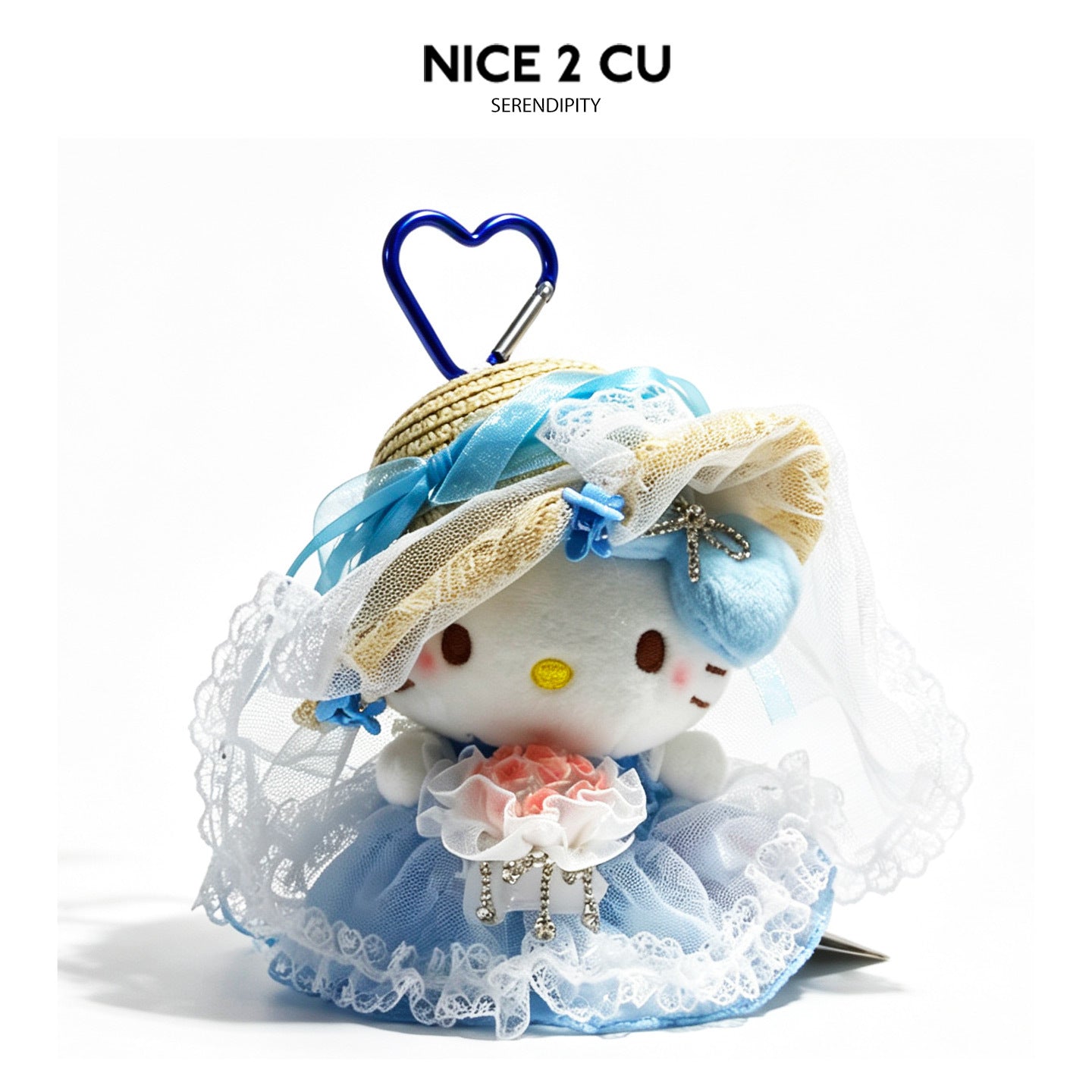 Plush cat figure in blue tulle veil and straw hat with blue heart carabiner clip