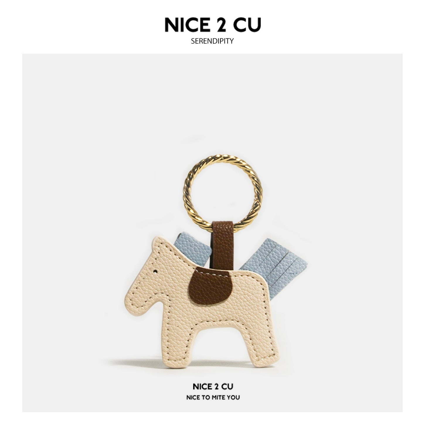 Beige and light blue leather-look horse keychain charm with gold-tone twisted ring and brown saddle accent