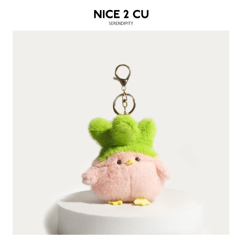Pink fluffy plush chick keychain charm with bright green fluffy hat and gold-tone clip attachment