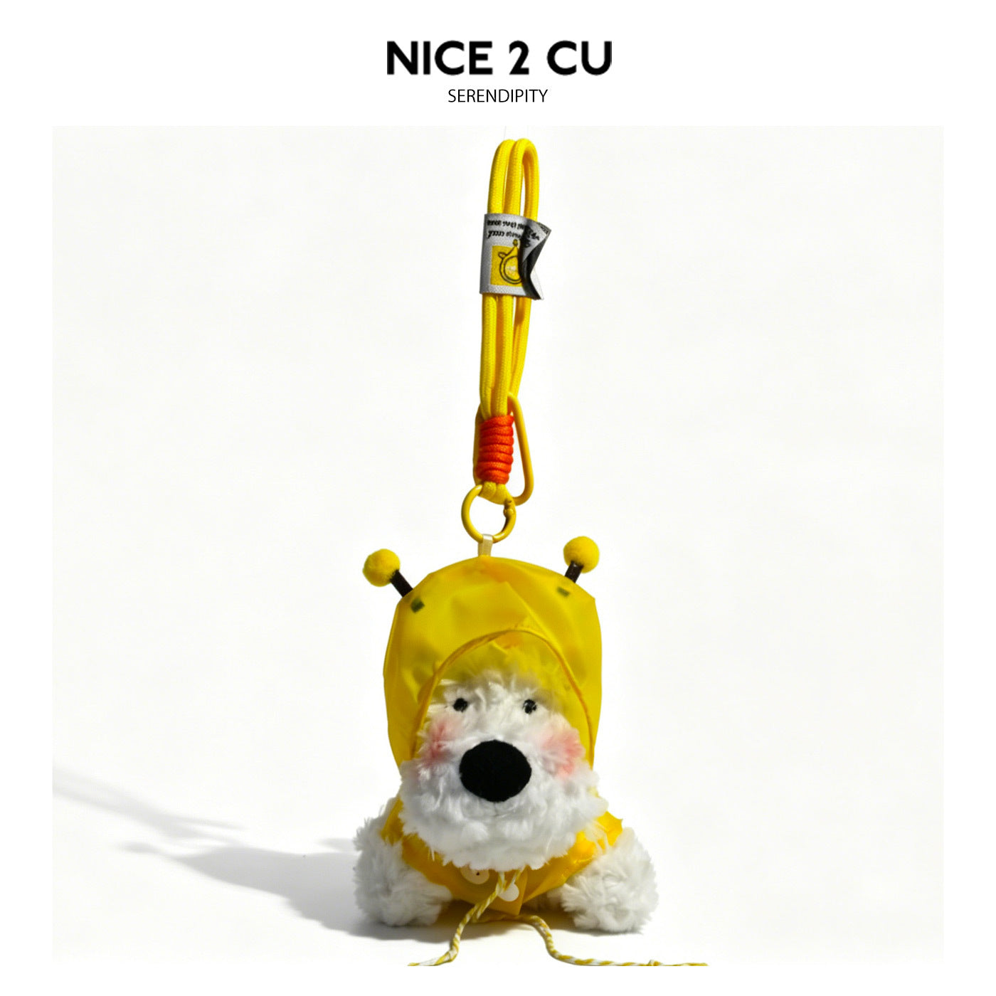 White plush dog charm in a yellow hooded raincoat with matching yellow braided hanging strap