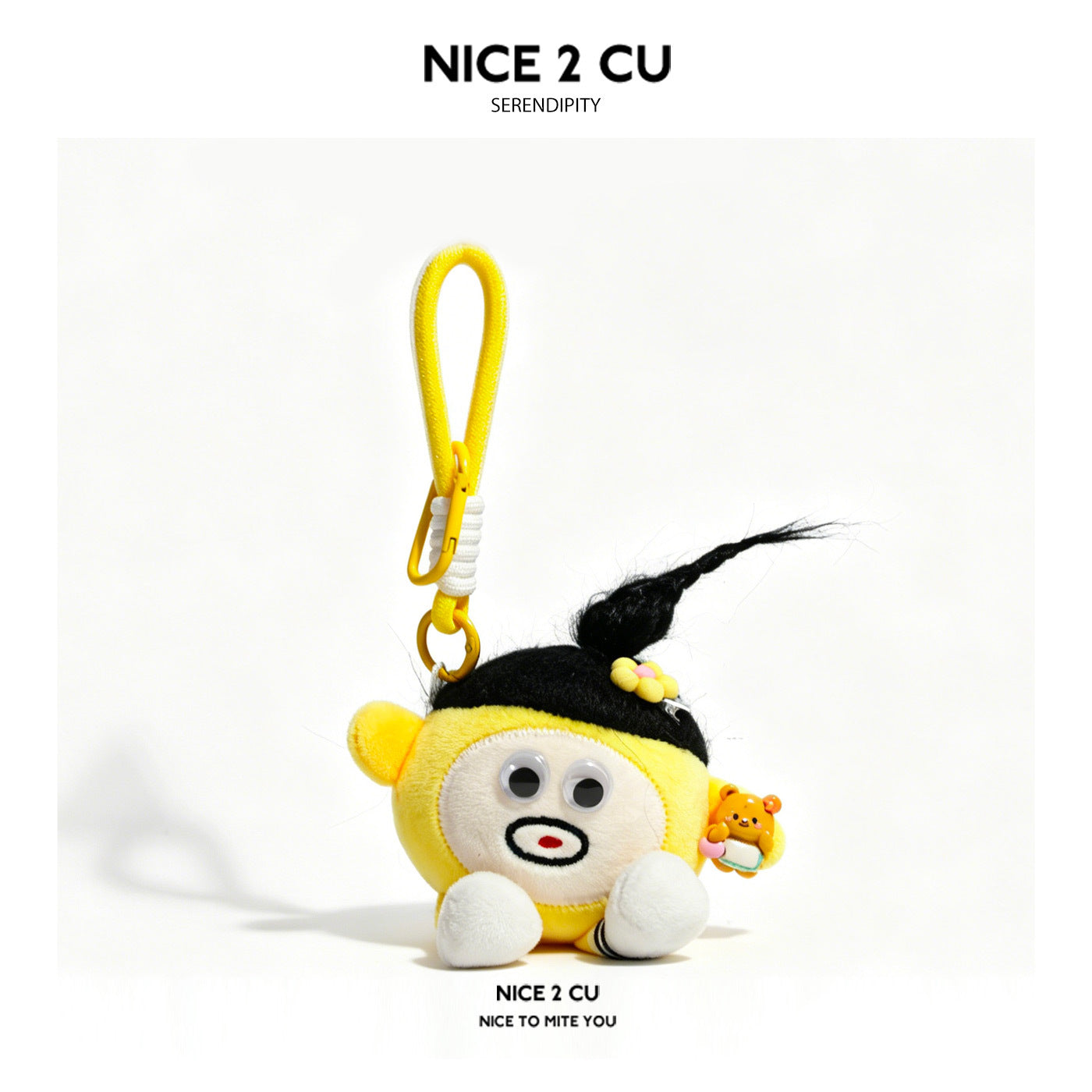 Yellow kawaii plush keychain charm with black fiber braid, googly eyes, flower clip, and mini bear figurine on carabiner clip