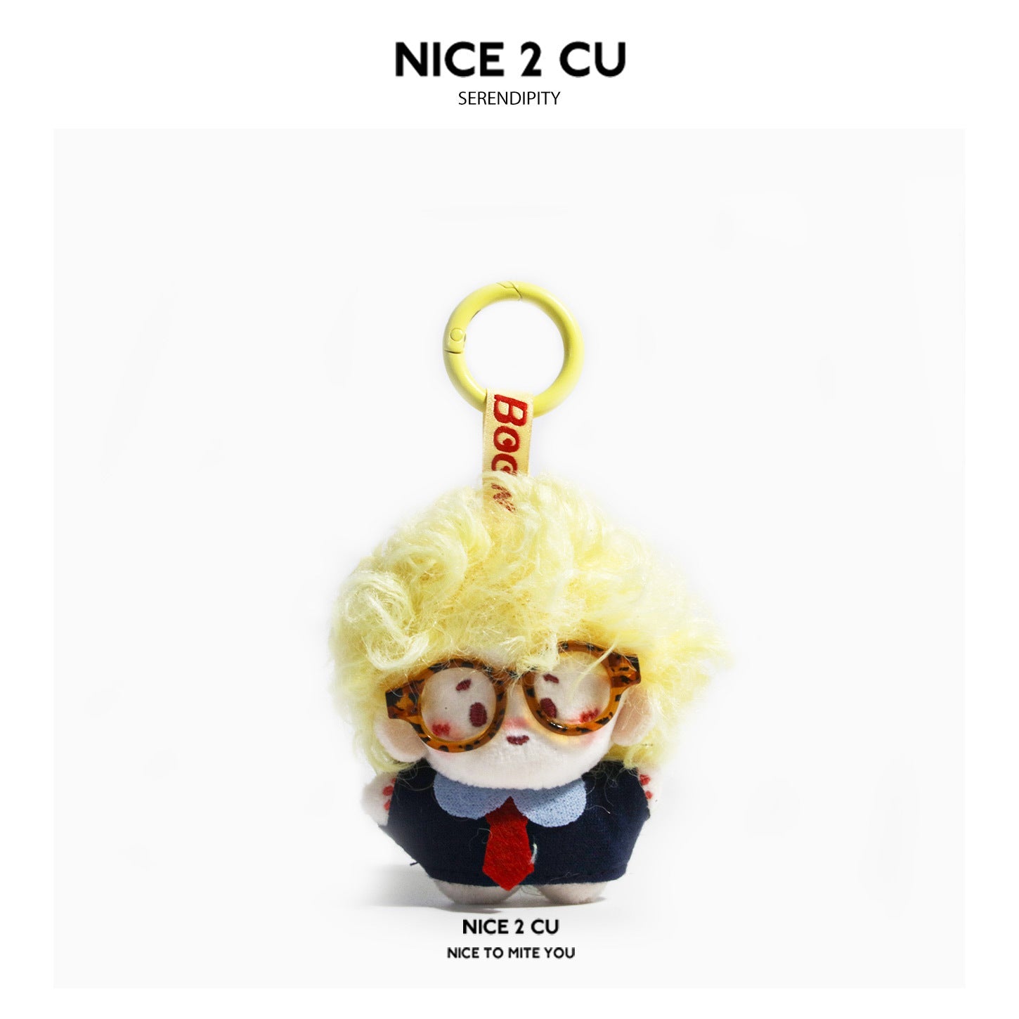 Yellow curly-haired chibi plush doll keychain with tortoiseshell glasses and navy blazer on gold carabiner ring
