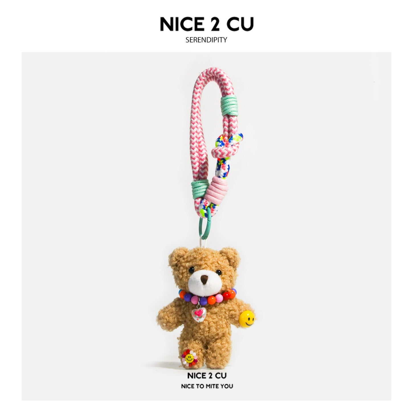 Tan plush teddy bear bag charm with multicolor bead necklace, heart pendant, flower charm, and braided cord strap with pink a