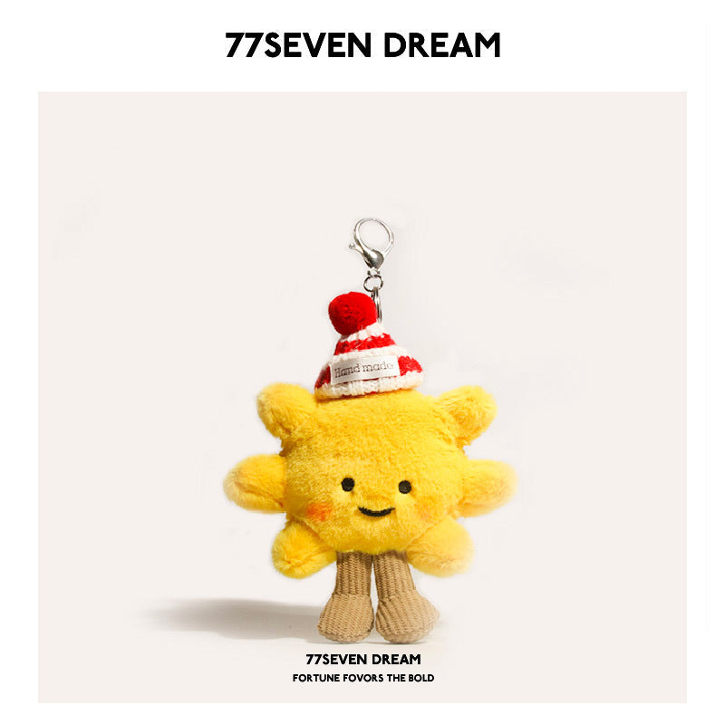 Yellow sunflower plush charm wearing a red-and-white striped knit hat with red pom-pom