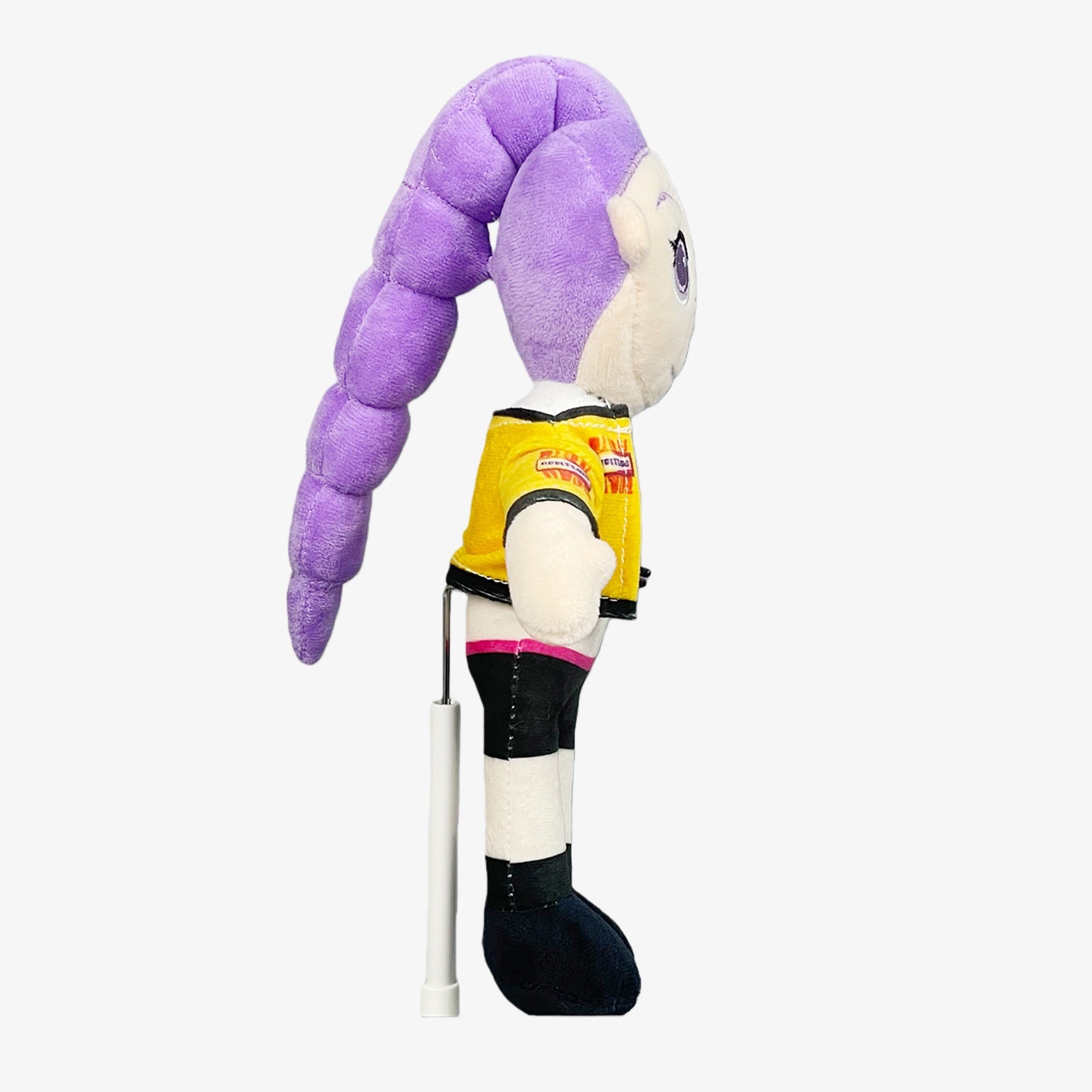 The Demon Hunters Inspired Plush Doll is a 10.6-inch anime-style female character with a purple hair bun, yellow jacket, and necklace—ideal for collectors and fans of unique Demon Hunters plushies.