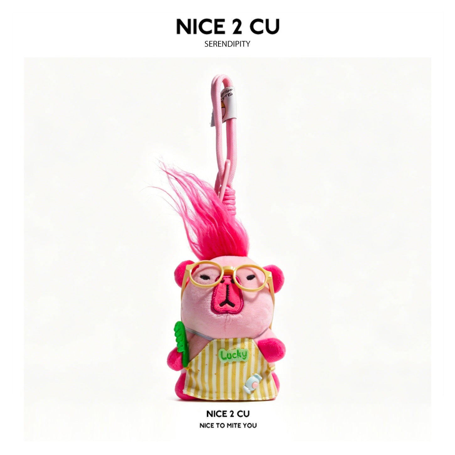 Kawaii pink capybara plush charm with spiky pink hair, yellow glasses, and yellow-and-white striped apron embroidered with 'L